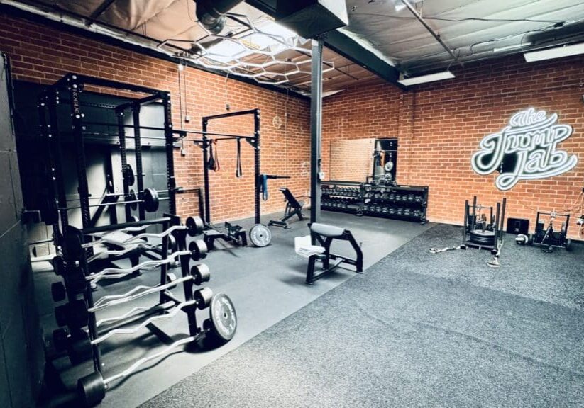 A gym with many different types of equipment.